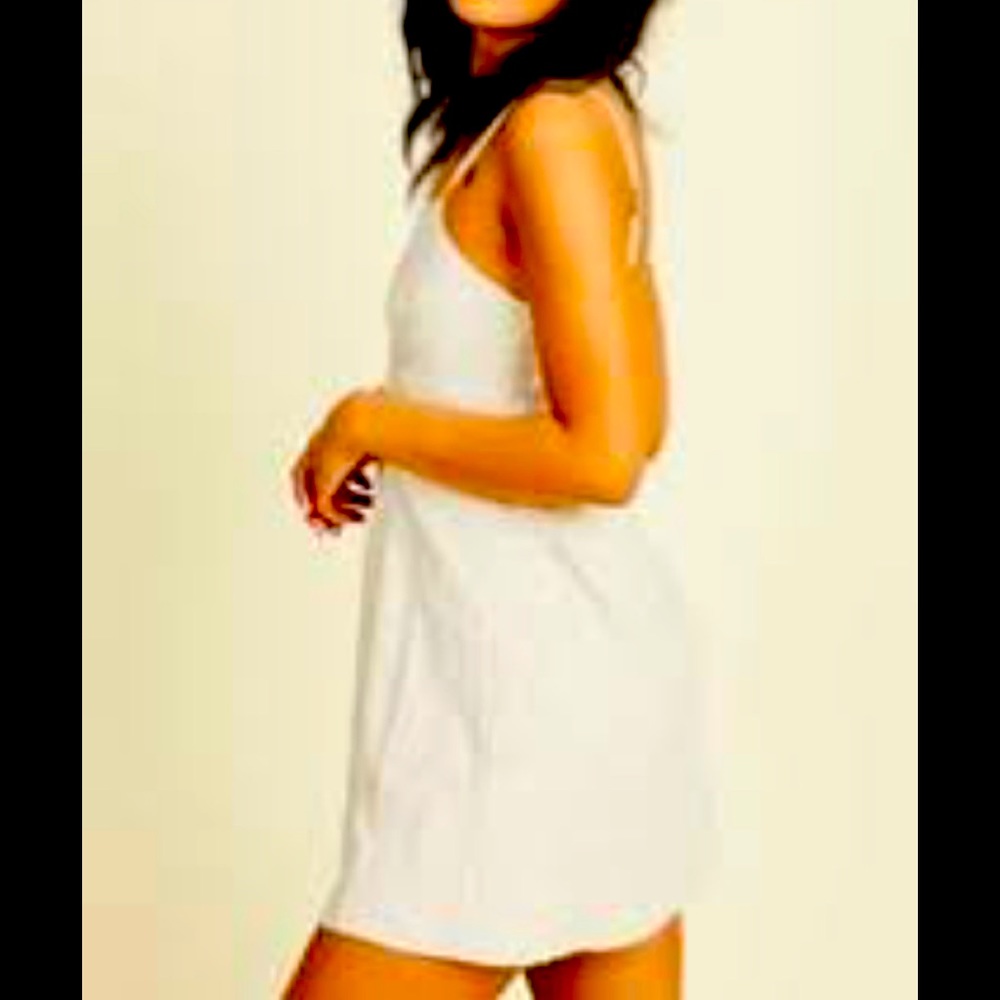 Eyelet lace Ivory dress  Mini dress, form fitting adjustable straps. Backless
